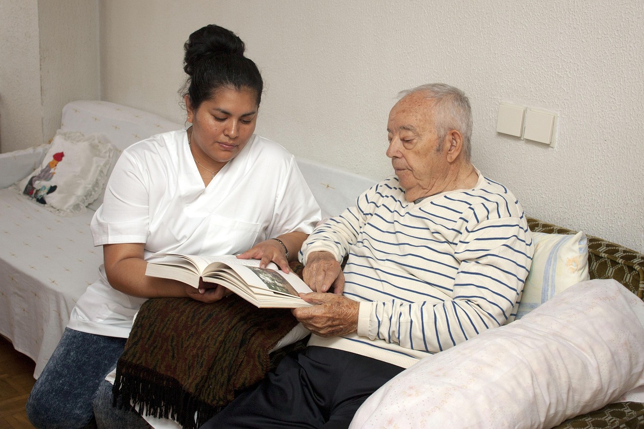 A caregiver reading together with a senior